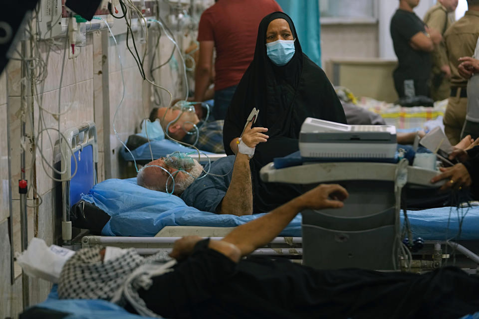 People with breathing problems are treated at a hospital during a sandstorm in Baghdad, Iraq, Monday, May 23, 2022. (AP Photo/Hadi Mizban)