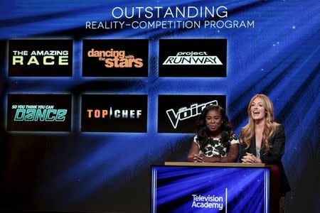 Actresses and nominees Uzo Aduba (L) and Cat Deeley (R) are pictured during the nomination announcements for the 67th Primetime Emmy Awards in West Hollywood, California July 16, 2015. REUTERS/Jonathan Alcorn