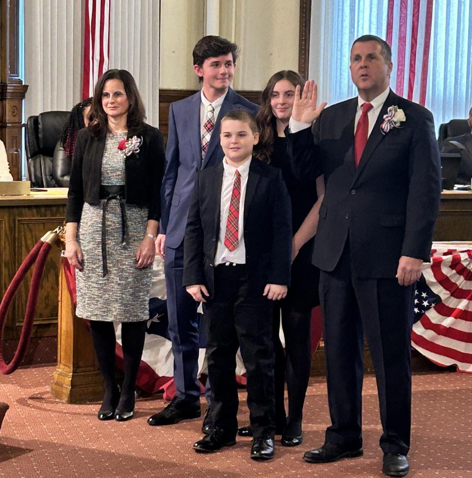 Mayor Robert F. Sullivan, right, is sworn in to his third term at Brockton City Hall on Jan. 1, 2024. From left is his family: Wife, Maria and their three children: Tommy, William and Grace.