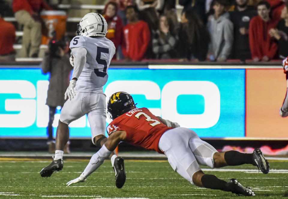 COLLEGE PARK, MD - NOVEMBER 06: Penn State Nittany Lions wide receiver Jahan Dotson (5) runs away from Maryland Terrapins defensive back Nick Cross (3) on a 31 yard touchdown reception during the Penn State Nittany Lions game versus the Maryland Terrapins on November 6, 2021 at Capital One Field at Maryland Stadium in College Park, MD.  (Photo by Mark Goldman/Icon Sportswire via Getty Images)