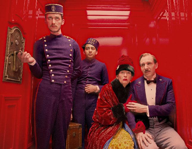 This film image released by Fox Searchlight Films shows Paul Schlase, Tony Revelori, Tilda Swinton and Ralph Fiennes in a scene from "The Grand Budapest Hotel." (AP Photo/Fox Searchlight Films, Martin Scali)