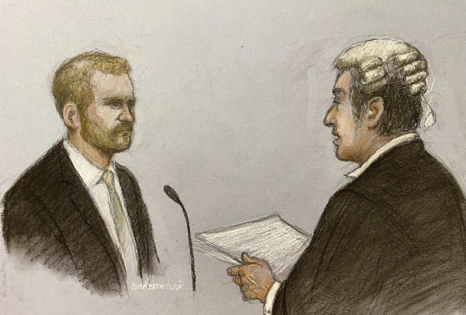 This court artist sketch by Elizabeth Cook shows Britain's Prince Harry, left, with his counsel David Sherborne giving evidence at the Rolls Buildings in central London, Wednesday, June 7, 2023. (Elizabeth Cook/PA via AP)