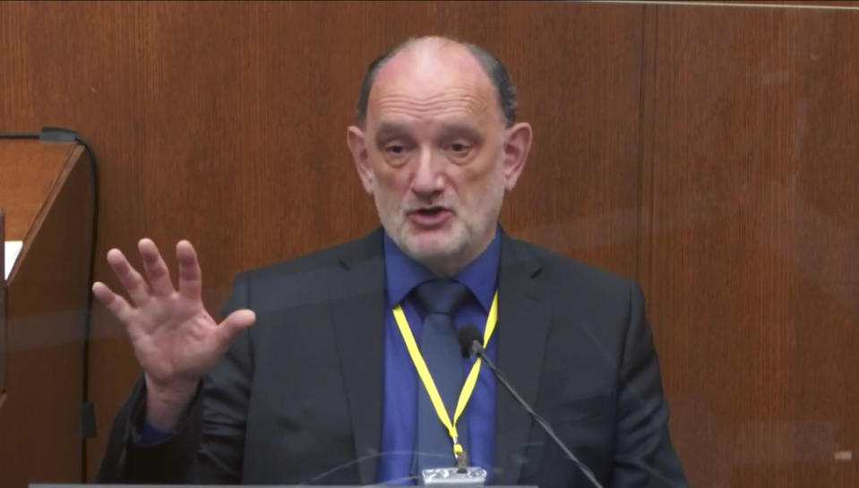 In this image from video, Dr. David Fowler, a retired forensic pathologist and former chief medical examiner for the state of Maryland testifies as Hennepin County Judge Peter Cahill presides, Wednesday, April 14, 2021, in the trial of former Minneapolis police Officer Derek Chauvin at the Hennepin County Courthouse in Minneapolis, Minn. Chauvin is charged in the May 25, 2020 death of George Floyd. (Court TV via AP, Pool)