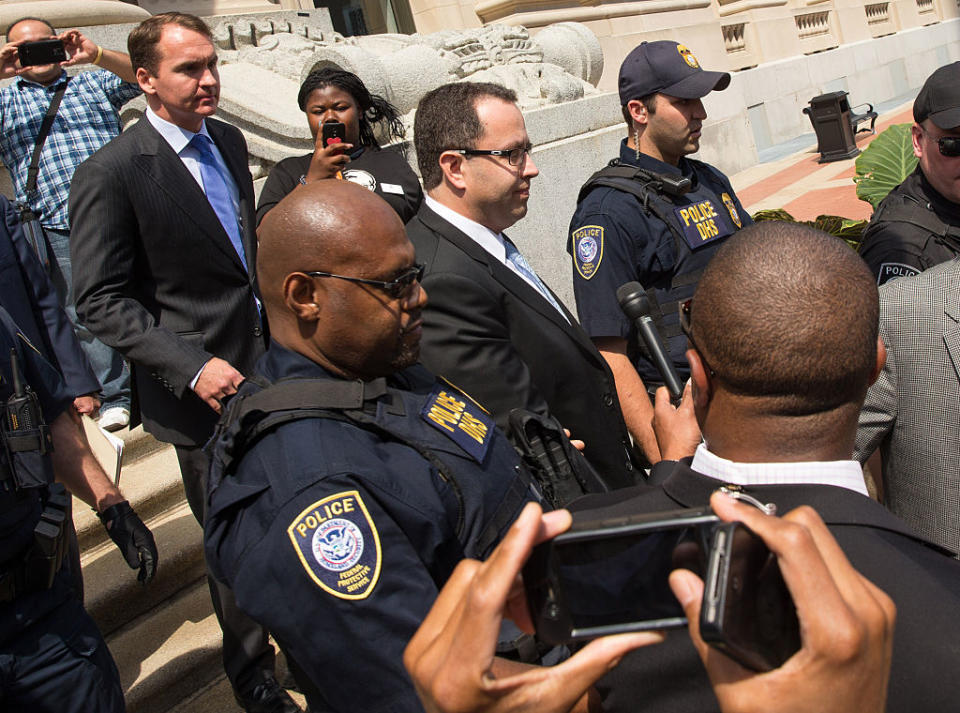 Jared Fogle, center, leaves an Indianapolis courthouse on Aug. 19, 2015, after Fogle after pleading guilty to federal charges related to child pornography and having sex with minors. (Photo: Joey Foley/Getty Images)