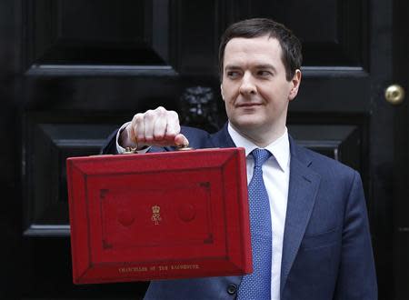 Britain's Chancellor of the Exchequer, George Osborne, holds up his budget case for the cameras as he stands outside number 11 Downing Street, before delivering his budget to the House of Commons, in central London March 19, 2014. REUTERS/Suzanne Plunkett