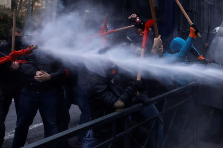 Riot police uses tear gas during clashes with protesters demonstrating outside the parliament building against government plans to change hiring procedures in the public sector in Athens, Greece, January 14, 2019. REUTERS/Alkis Konstantinidis