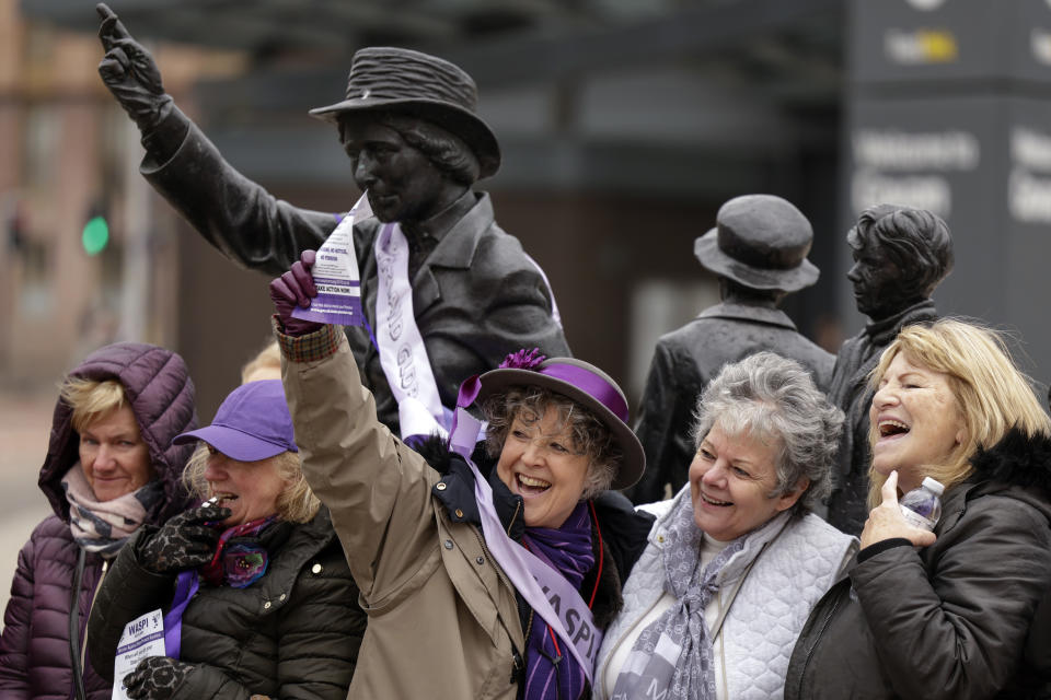 GLASGOW, SCOTLAND - MARCH 08: WASPI women gather at the statue of political activist Mary Barbour in Govan to mark International Women’s Day on March 08, 2024 in Glasgow, Scotland. The Women Against State Pension Inequality (WASPI) organisation is campaigning to receive compensation after their State pension earnings were affected by the change in state pension age in 1995 and 2011. (Photo by Jeff J Mitchell/Getty Images)