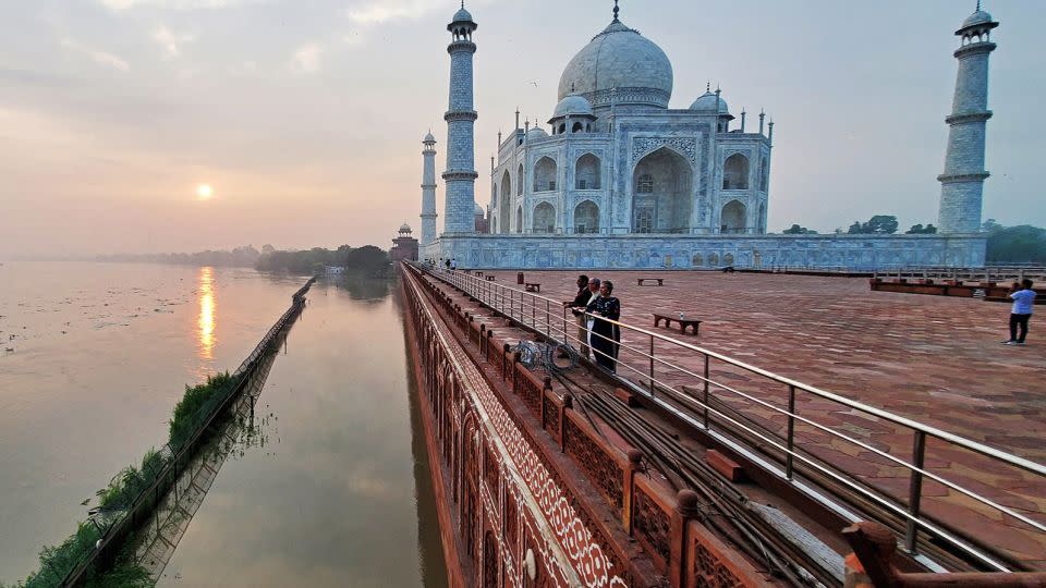 The flooded banks of the Yamuna river along the Taj Mahal in Agra, in July 2023. Flooding and landslides are common and cause widespread devastation during India's treacherous monsoon season, but experts say climate change is increasing their frequency and severity. - Pawan Sharma/AFP/Getty Images