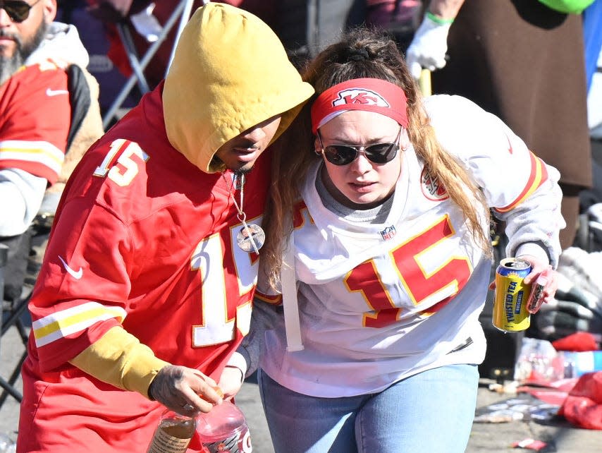 Fans leave the area after shots were fired after the celebration of the Kansas City Chiefs winning Super Bowl LVIII.