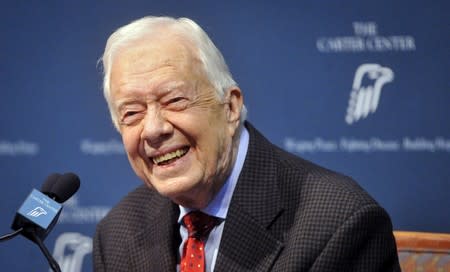 FILE PHOTO - Former U.S. President Jimmy Carter takes questions from the media during a news conference at the Carter Center in Atlanta