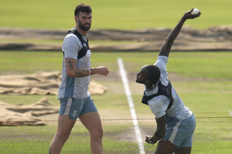 England's Reece Topley, left, watches teammate Jofra Archer bowl during a training session ahead of the first one day international cricket match between Bangladesh and England in Dhaka, Bangladesh, Tuesday, Feb. 28, 2023. (AP Photo/Aijaz Rahi)