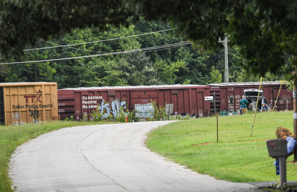 Two railroad cars derailed at the scene of a train derailment along State Highway 20 just outside the city limits of Belton, S.C. Thursday, July 25, 2024.