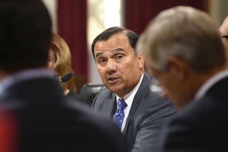 SoCal Gas President and CEO Dennis Arriola apologizes during his statements as the Los Angeles City Council conducts testimony on the ongoing natural gas leak in the Porter Ranch area of Los Angeles, California December 1, 2015. REUTERS/Gus Ruelas