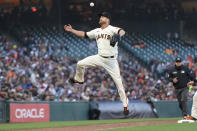 San Francisco Giants pitcher Alex Cobb cannot field a base hit by New York Mets' Starling Marte during the third inning of a baseball game in San Francisco, Monday, May 23, 2022. (AP Photo/Jeff Chiu)