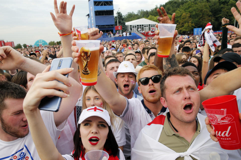 England fans cheer as they watch the Russia 2018 World Cup play-off for third place football match between Belgium and England at Moscow's fan zone on July 14, 2018. (Photo by Maxim ZMEYEV / AFP) / RESTRICTED TO EDITORIAL USE - NO MOBILE PUSH ALERTS/DOWNLOADS        (Photo credit should read MAXIM ZMEYEV/AFP/Getty Images)