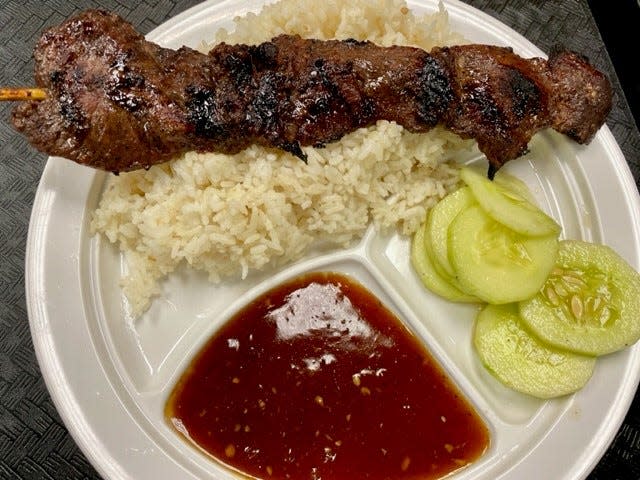 Manila Hibachi's menu includes Filipino barbecue, silog dishes that include a fried egg, fried lumpia and crab Rangoon, and desserts. The dish above includes beef barbecue.
