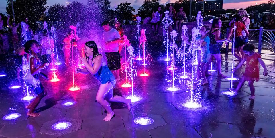 Children play in the Splash Pad at the Fountain of Gateway during the Celebration Under the Stars event, Monday, July 4, 2022.