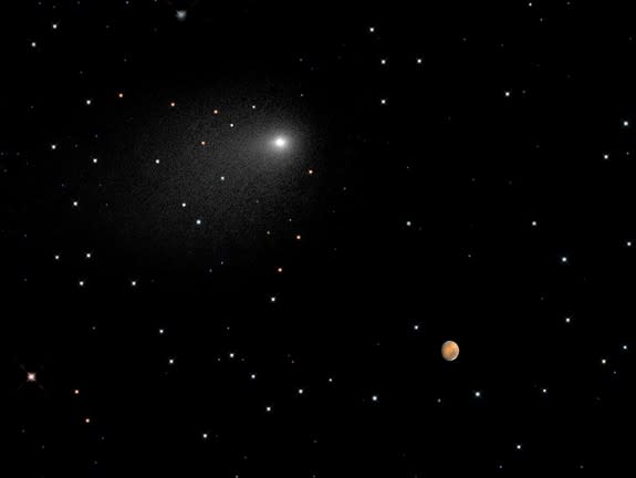 A NASA Hubble Space Telescope composite image shows the positions of comet Siding Spring and Mars as the comet streaked by the red planet, at 2:28 p.m. EDT on Oct. 19, 2014.