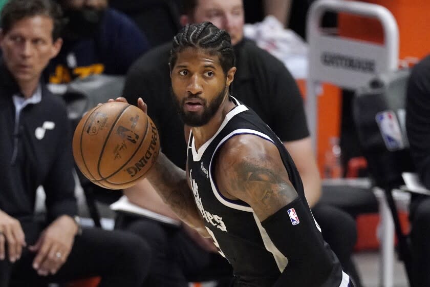 FILE - Los Angeles Clippers guard Paul George dribbles during the second half in Game 6.