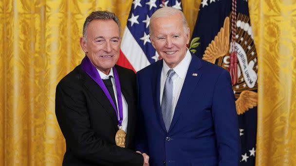 PHOTO: National Medal of Arts recipient, musician Bruce Springsteen shakes hands with President Joe Biden after the president presented Springsteen with his medal during a ceremony in the East Room at the White House in Washington, D.C., March 21, 2023. (Kevin Lamarque/Reuters)