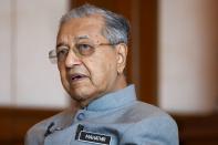 Malaysia's Prime Minister Mahathir Mohamad speaks during an interview with Reuters in Putrajaya