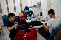 Syrian refugee boys work at a small textile factory in Gaziantep, where they are employed by a 30-year-old Turk who gave his name as Selim, in Turkey, May 16, 2016. Picture taken May 16, 2016. REUTERS/Umit Bektas