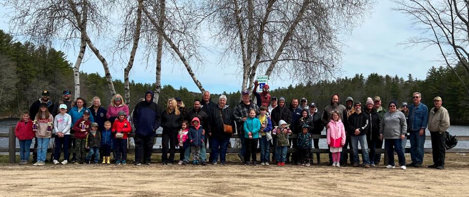 Elk Members and their children gather for a group photograph at the conclusion of the Kids Fishing Derby.