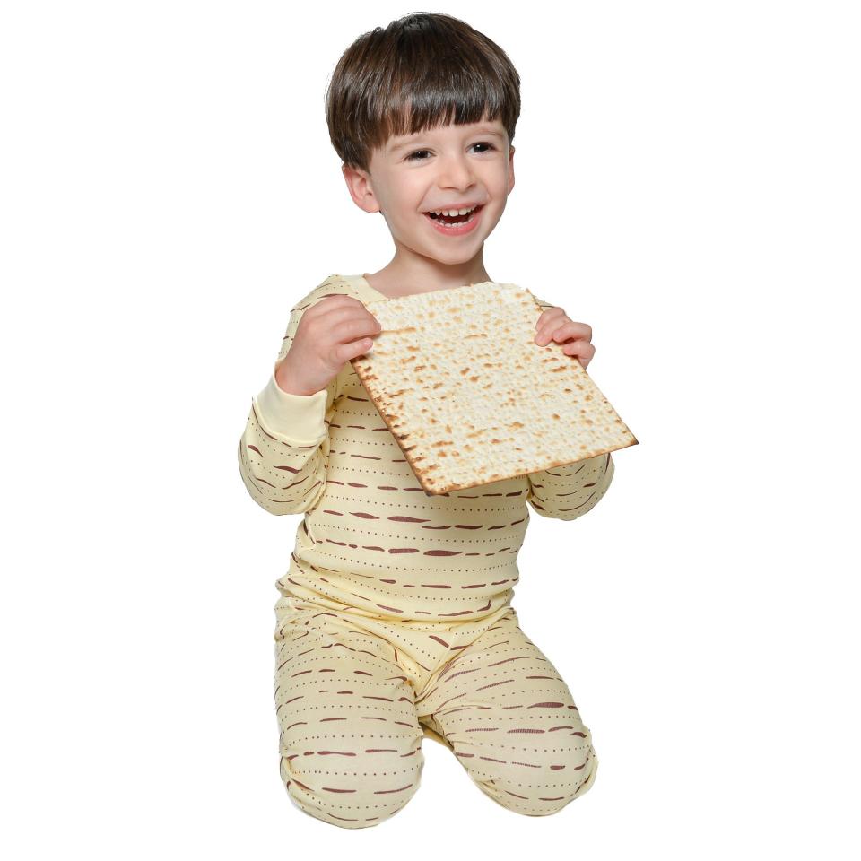A boy wearing matza-themed pajamas.