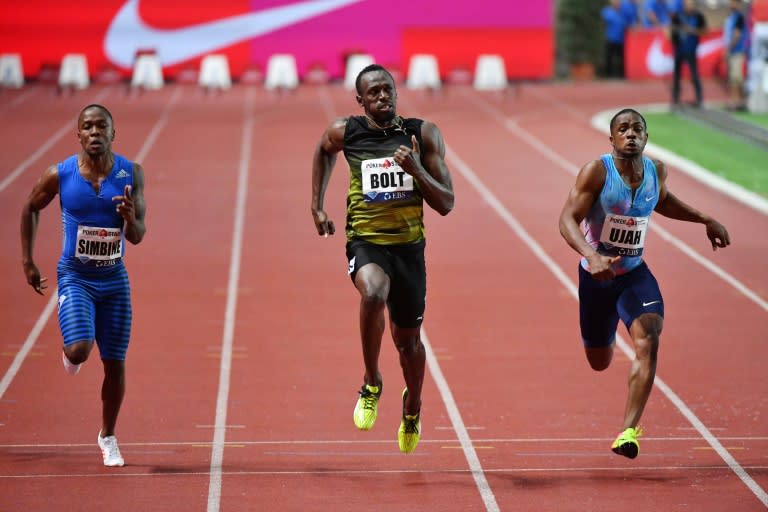 Jamaica's Usain Bolt (C) runs to win the men's 100m event at the IAAF Diamond League athletics meeting in Monaco on July 21, 2017