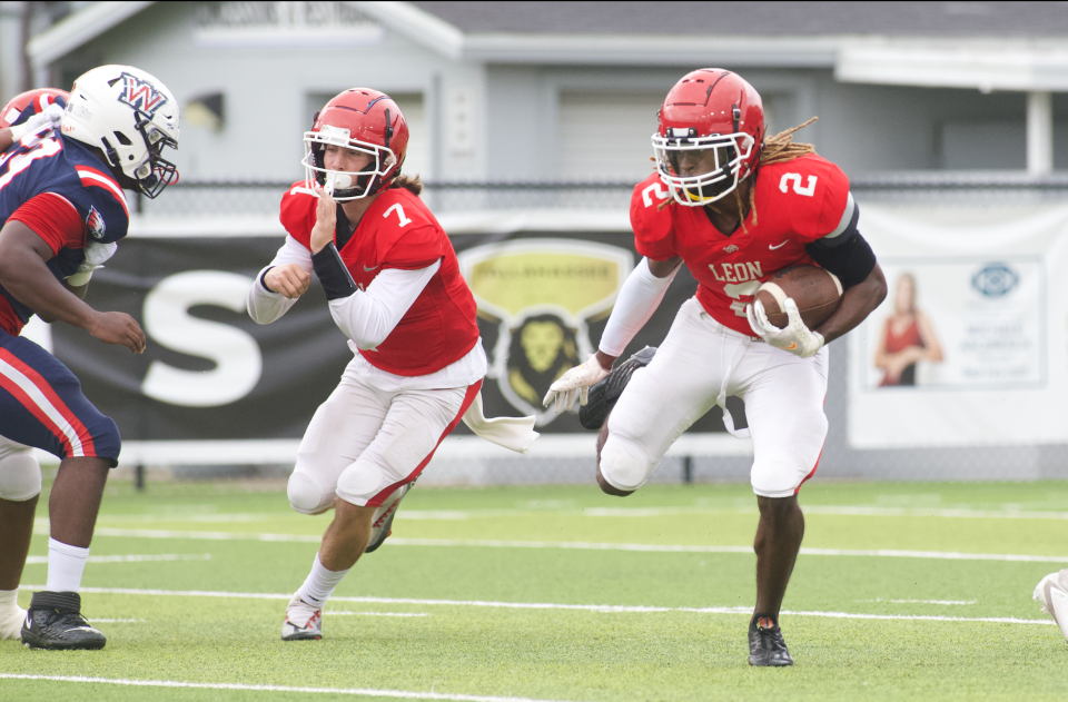 Leon senior DJ Hepburn rushes the ball during the Leon County Spring Jamboree on May 18, 2023, at Gene Cox Stadium.