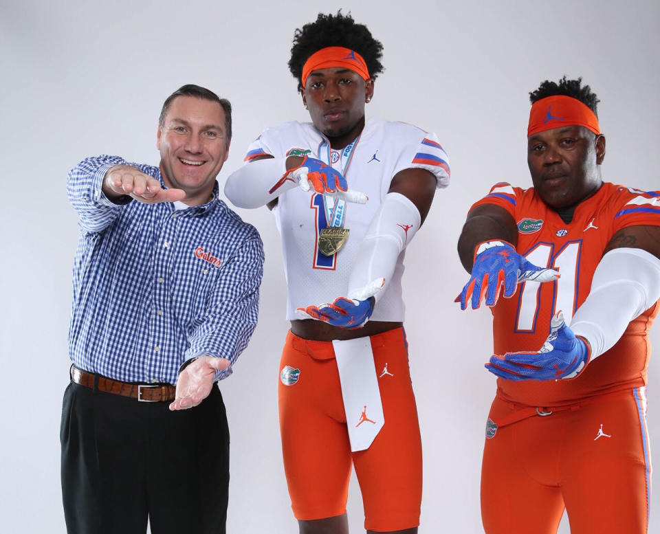A recruit’s father hilariously suited up in full uniform with his son while making an official visit at Florida last weekend. (Twitter.com/HimsoHam)