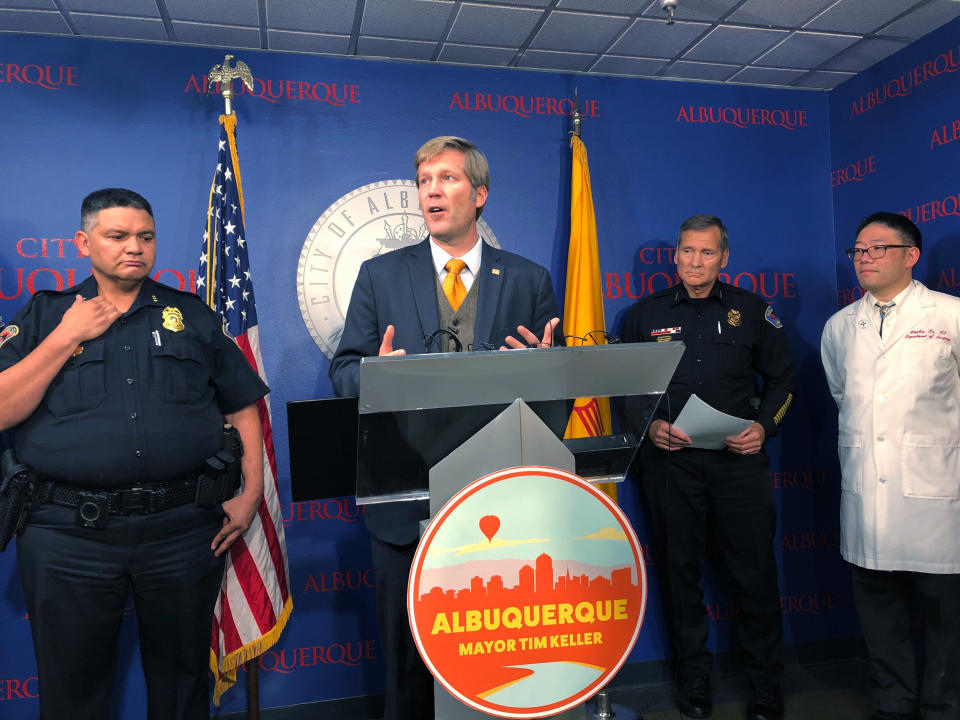 Albuquerque Mayor Tim Keller, center, discusses a workplace shooting that injured three employees at a food distribution warehouse during a news conference in Albuquerque, N.M., on Tuesday, Nov. 13, 2018. Police said the gunman, identified as Waid Anthony Melton, shot and killed himself hours later in a remote location north of Albuquerque. Keller used the shooting to call for New Mexico's newly elected Democrat governor and the Democrat-controlled Legislature to address gun violence. (AP Photo/Mary Hudetz)