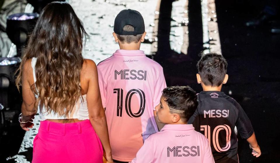 Lionel Messi’s wife, Antonela Roccuzzo, and sons, Thiago, Mateo and Ciro walk on the stage during Inter Miami’s The Unveil event at DRV PNK Stadium on Sunday, July 16, 2023, in Fort Lauderdale, Fla. The event was held to officially welcome Argentine forward Lionel Messi (10) and Spanish midfielder Sergio Busquets (5) to the team. MATIAS J. OCNER/mocner@miamiherald.com