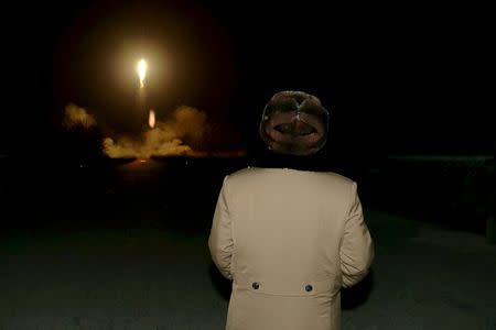 North Korean leader Kim Jong Un watches the ballistic rocket launch drill of the Strategic Force of the Korean People's Army (KPA) at an unknown location, in this undated file photo released by North Korea's Korean Central News Agency (KCNA) in Pyongyang on March 11, 2016. REUTERS/KCNA/Files