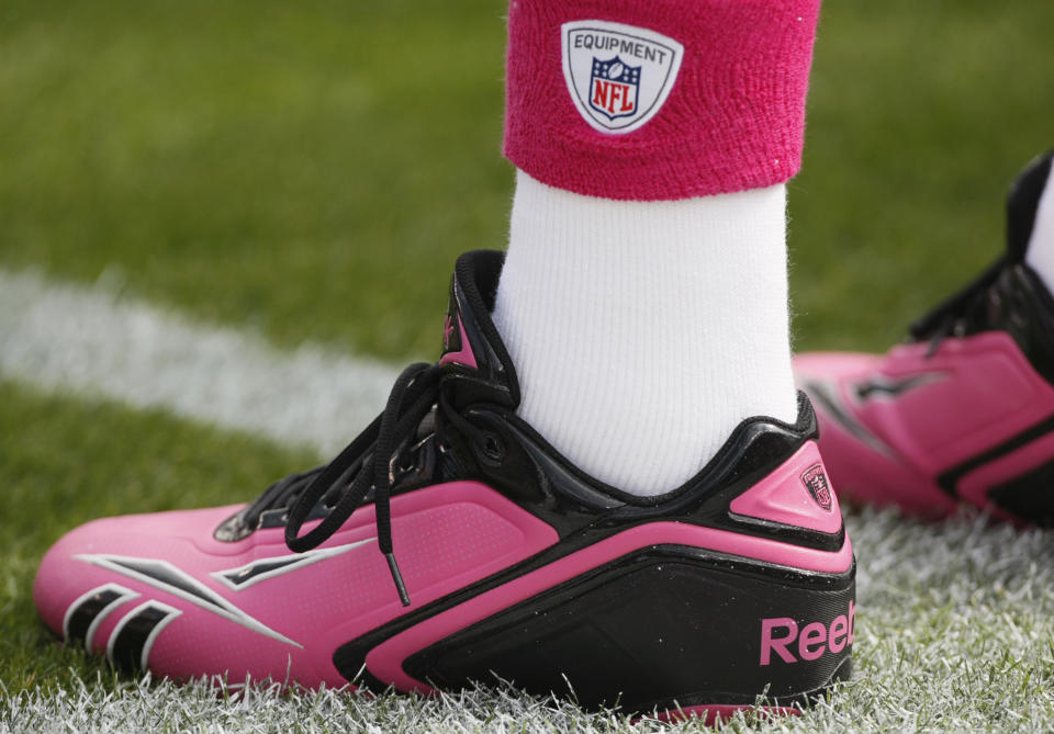 A Denver Broncos player wears pink cleats in recognition of breast cancer awareness month before competing against the Dallas Cowboys in their NFL football game in Denver October 4, 2009. REUTERS/Rick Wilking (UNITED STATES SPORT FOOTBALL)