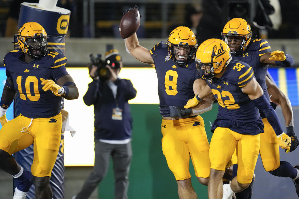 California linebacker Jackson Sirmon (8) celebrates with teammates after scoring a touchdown on a recovery of a Stanford fumble during the second half of an NCAA college football game in Berkeley, Calif., Saturday, Nov. 19, 2022. (AP Photo/Godofredo A. Vásquez)