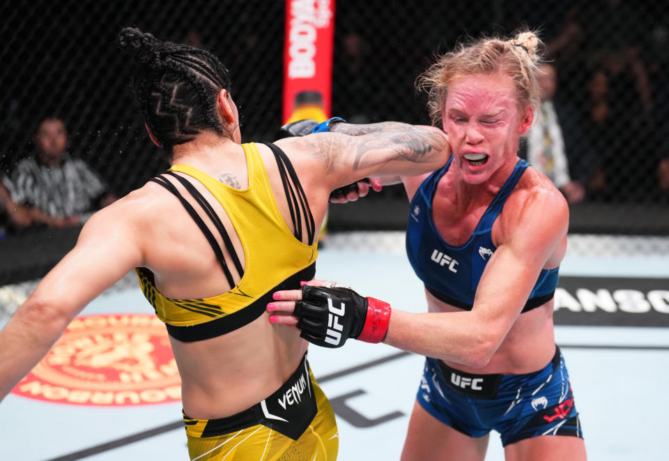 LAS VEGAS, NEVADA - MAY 21: (L-R) Ketlen Vieira of Brazil lands a spinning back-elbow against Holly Holm in a bantamweight bout during the UFC Fight Night event at UFC APEX on May 21, 2022 in Las Vegas, Nevada. (Photo by Chris Unger/Zuffa LLC)