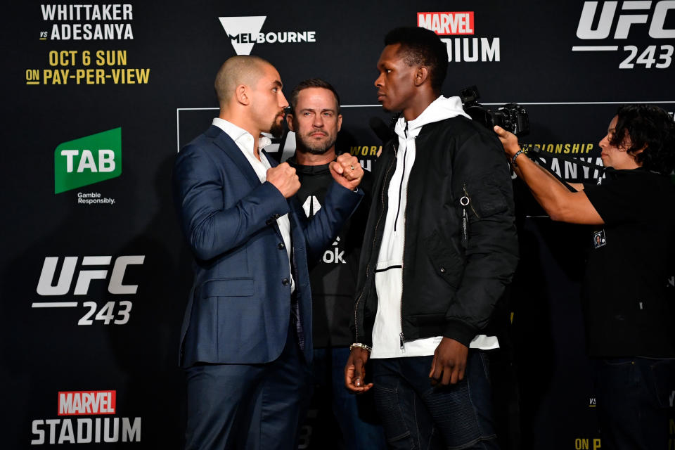 MELBOURNE, AUSTRALIA - OCTOBER 04:  (L-R) UFC middleweight champion Robert Whittaker of New Zealand and UFC interim middleweight champion Israel Adesanya of New Zealand face off for the media during UFC 243 Ultimate Media Day at Marvel Stadium on October 4, 2019 in Melbourne, Australia. (Photo by Jeff Bottari/Zuffa LLC/Zuffa LLC via Getty Images)