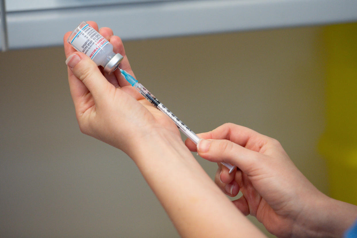 CARMARTHEN, WALES - APRIL 07: A nurse prepares the Moderna Covid-19 vaccine, at the West Wales General Hospital in Carmarthen, on April 7, 2021 in Carmarthen, Wales. Moderna, the third vaccine to be approved for use in the UK, is to be given to patients in Wales from Wednesday. Five thousand doses of the vaccine were sent to vaccination centres in the Hywel Dda University Health Board area on Tuesday. The vaccine's approval by the UK's Medicines and Healthcare products Regulatory Agency was announced on January 8. The UK has bought 17 million doses of the Moderna jab enough for 8.5 million people. (Photo by Jacob King - WPA Pool/Getty Images)