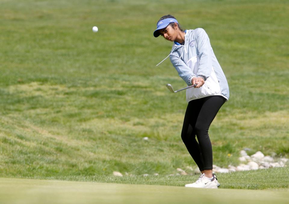 Holmdel's Sirina Ganne hits onto the 13th green at the Jumping Brook Country Club Monday, April 24, 2023, during the Shore Conference girls tournament.