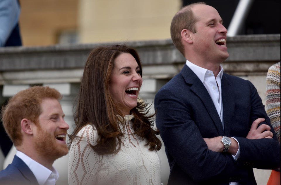 LONDON, UNITED KINGDOM - MAY 13: Prince Harry, Catherine, Duchess of Cambridge and Prince William, Duke of Cambridge laugh as they host a tea party in the grounds of Buckingham Palace to honour the children of those who have died serving in the armed forces on May 13, 2017 in London, England. (Photo by Andrew Parsons - WPA Pool/Getty Images)