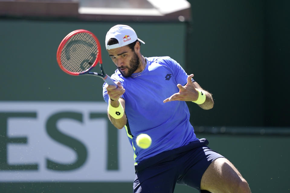 Matteo Berrettini, of Italy, returns a shot to Alejandro Tabilo, of Chile, at the BNP Paribas Open tennis tournament Sunday, Oct. 10, 2021, in Indian Wells, Calif. (AP Photo/Mark J. Terrill)