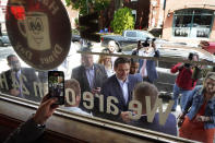 Florida Gov. Ron DeSantis greets people outside the Red Arrow Diner during a visit to Manchester, N.H., Friday, May 19, 2023. (AP Photo/Robert F. Bukaty)