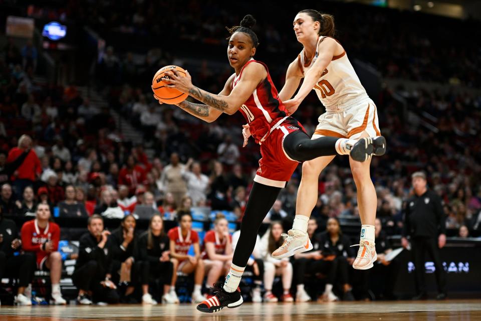 Texas guard Shay Holle defends North Carolina State guard Aziaha James in Sunday's 76-66 loss in an Elite Eight matchup in Portland. James scored 27 points. Texas ended its season at 33-5.