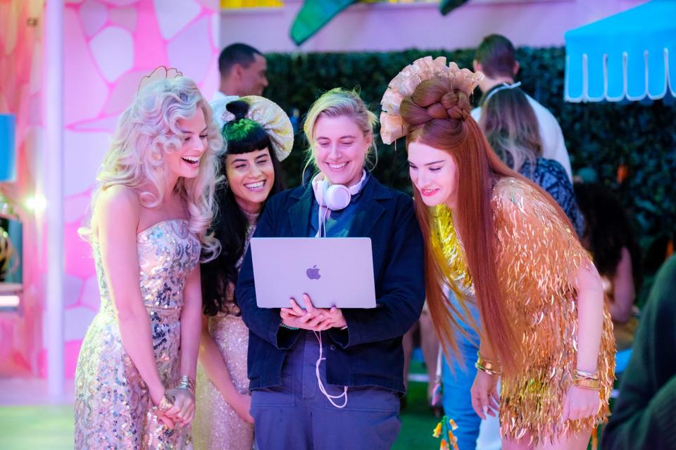 Margot Robbie, left, Ana Cruz Kayne, filmmaker Greta Gerwig and Hari Nef on the set of "Barbie."