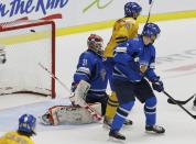 Finland's goalie Juuse Saros lets in a goal by Sweden's Christian Djoos, not seen, during the third period of their IIHF World Junior Championship ice hockey game in Malmo, Sweden, January 5, 2014. REUTERS/Alexander Demianchuk (SWEDEN - Tags: SPORT ICE HOCKEY)