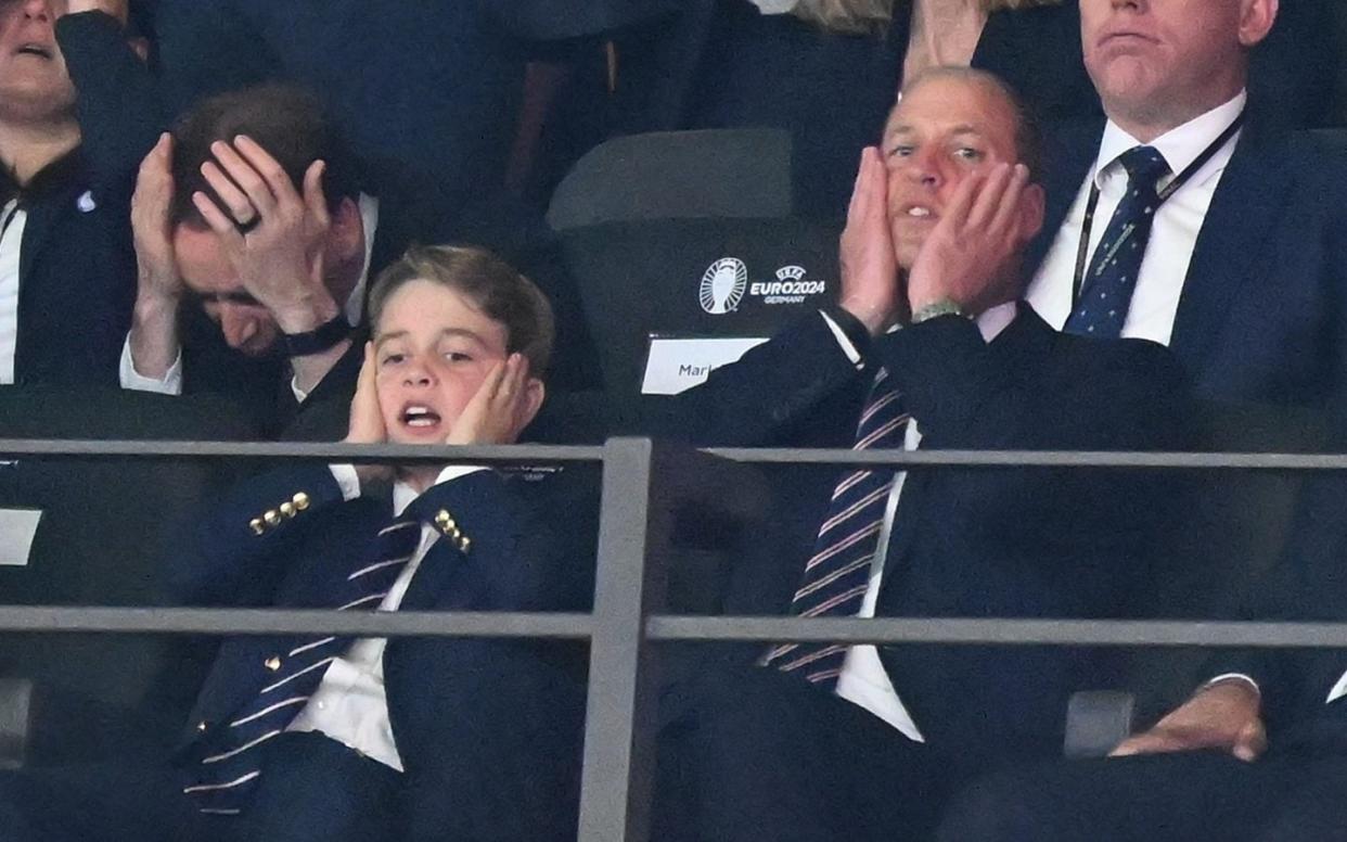 Prince George and the Prince of Wales suffer with the rest of the England fans in Berlin