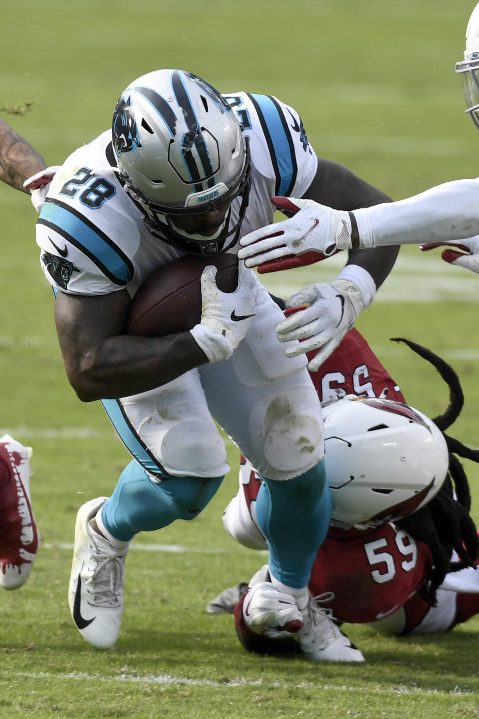 Carolina Panthers running back Mike Davis is tackled by Arizona Cardinals outside linebacker De'Vondre Campbell during the second half of an NFL football game Sunday, Oct. 4, 2020, in Charlotte, N.C. (AP Photo/Mike McCarn)
