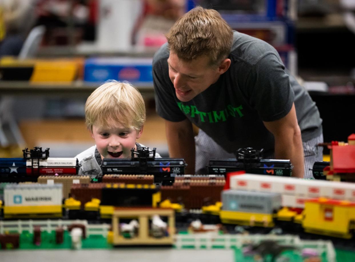 Bodhi, left, and Parker Burroughs check out the Lego train model built by Texas Brick Railroad at the Austin 2023 Train Show put on by the Austin Model Railway Society at the Palmer Events Center, May 6, 2023. 