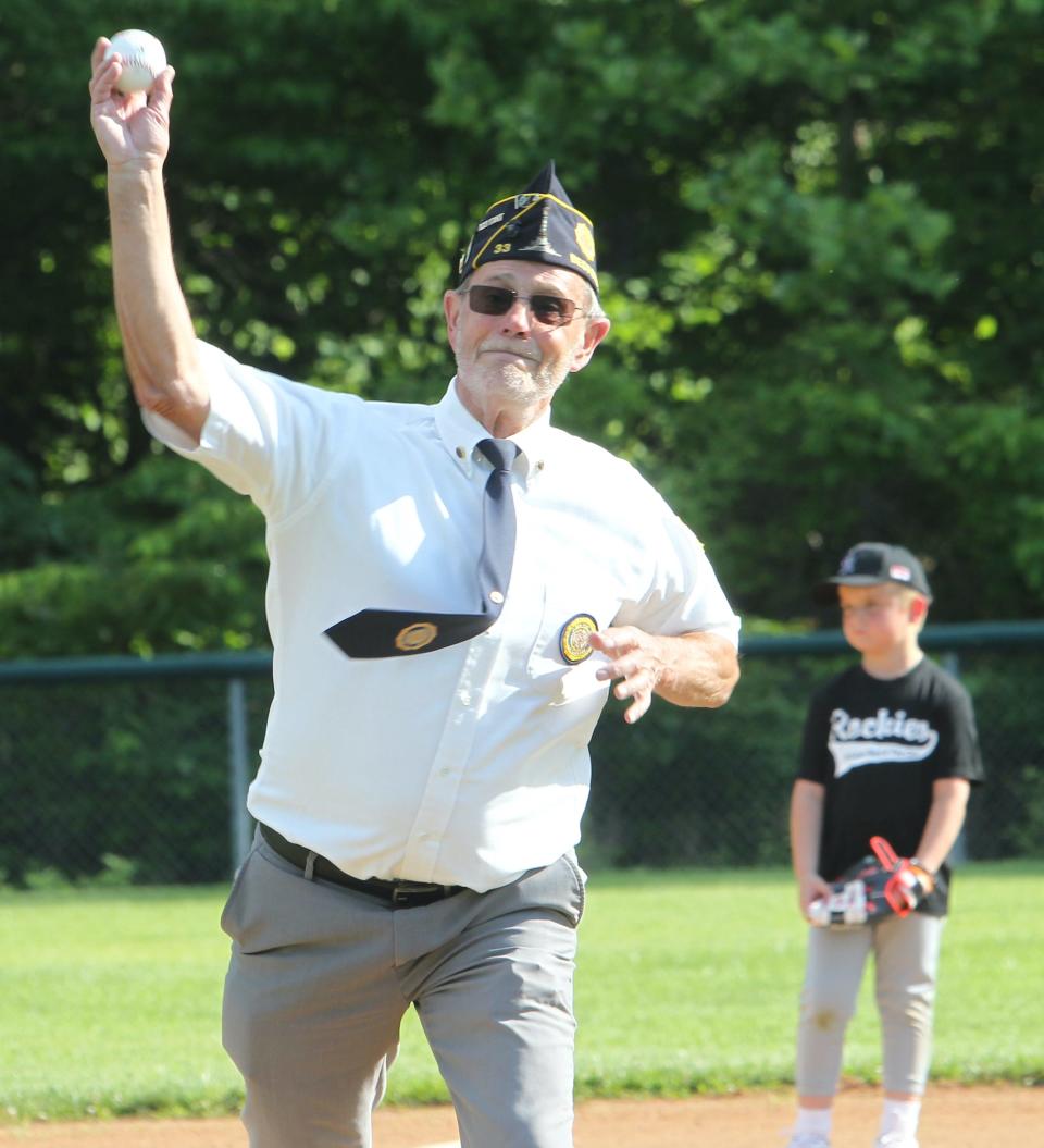 Veteran Mike Strunk throws out the first pitch at Baker Field during Wylie Park's opening day. About Wylie Park, Strunk said, "I enjoy doing this. I like to see the kids have fun. I played Little League myself a few years back."